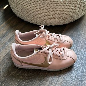 pink and gold nike cortez